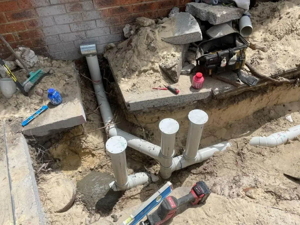 New PVC sewer junctions and risers in an open excavation